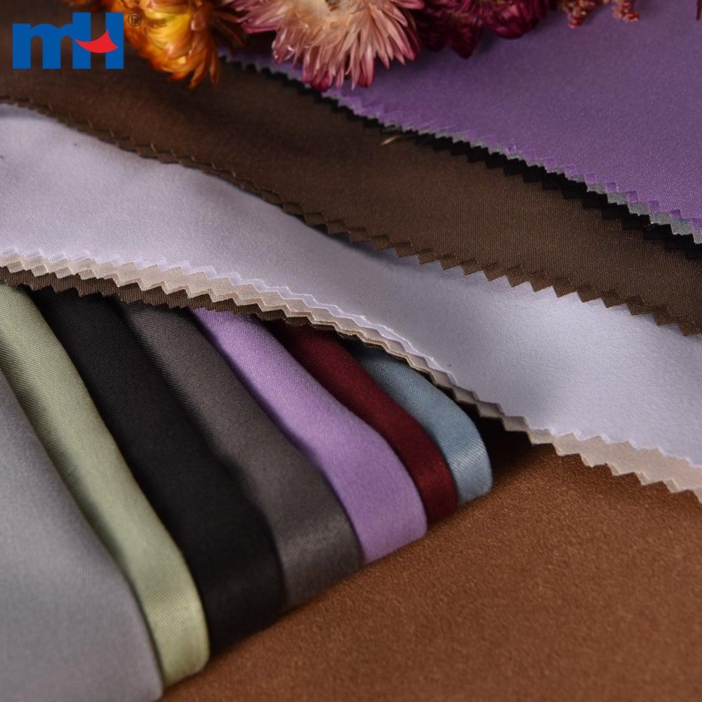 Tessuto in poliestere color pesca per abbigliamento