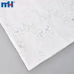 Бавовняна мереживна тканина з квітковою вишивкою