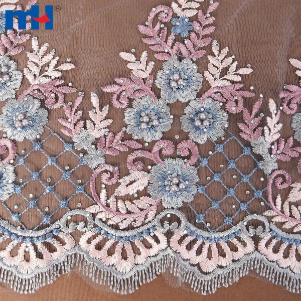 تصميم فستان من قماش الدانتيل والخرز والترتر