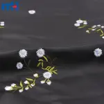 Çiçek işlemeli suni deri kumaş