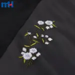 Çiçek işlemeli suni deri kumaş