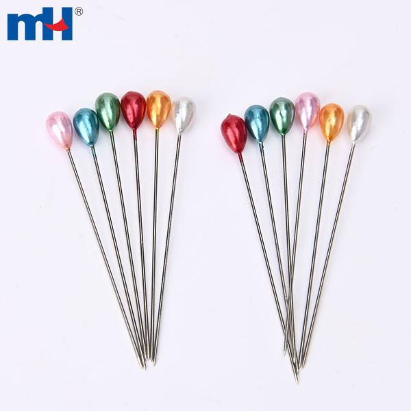 Beads, needles and sewing pins