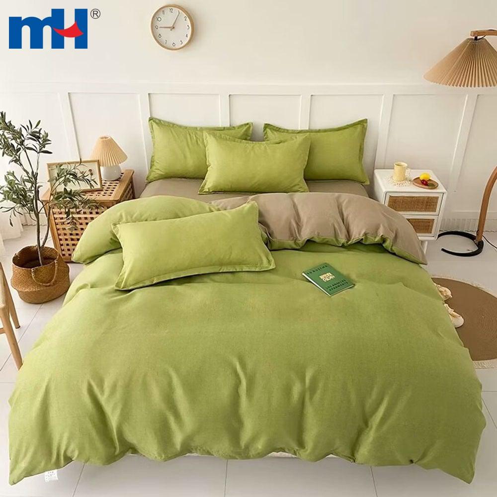 Set biancheria da letto composto da quattro pezzi in fibra di poliestere tinta unita