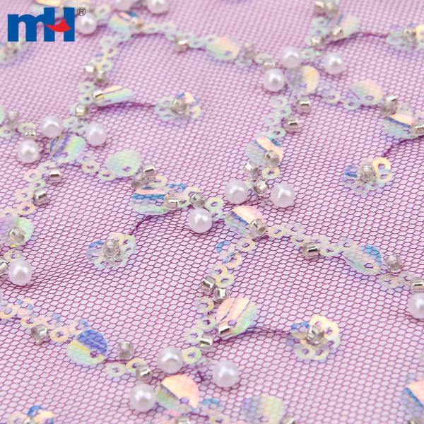 Wedding lace fabric decorated with sequins and pearls