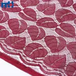 Tessuto di pizzo tricot non elastico con motivi a foglie
