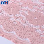 Non-elastic tricot lace fabric with a mix of large and small flowers